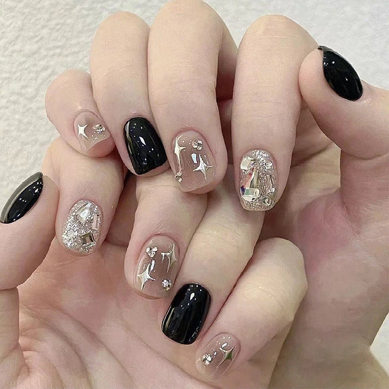 Elegant Nail Art with Glitter and Star Motifs Kalsten