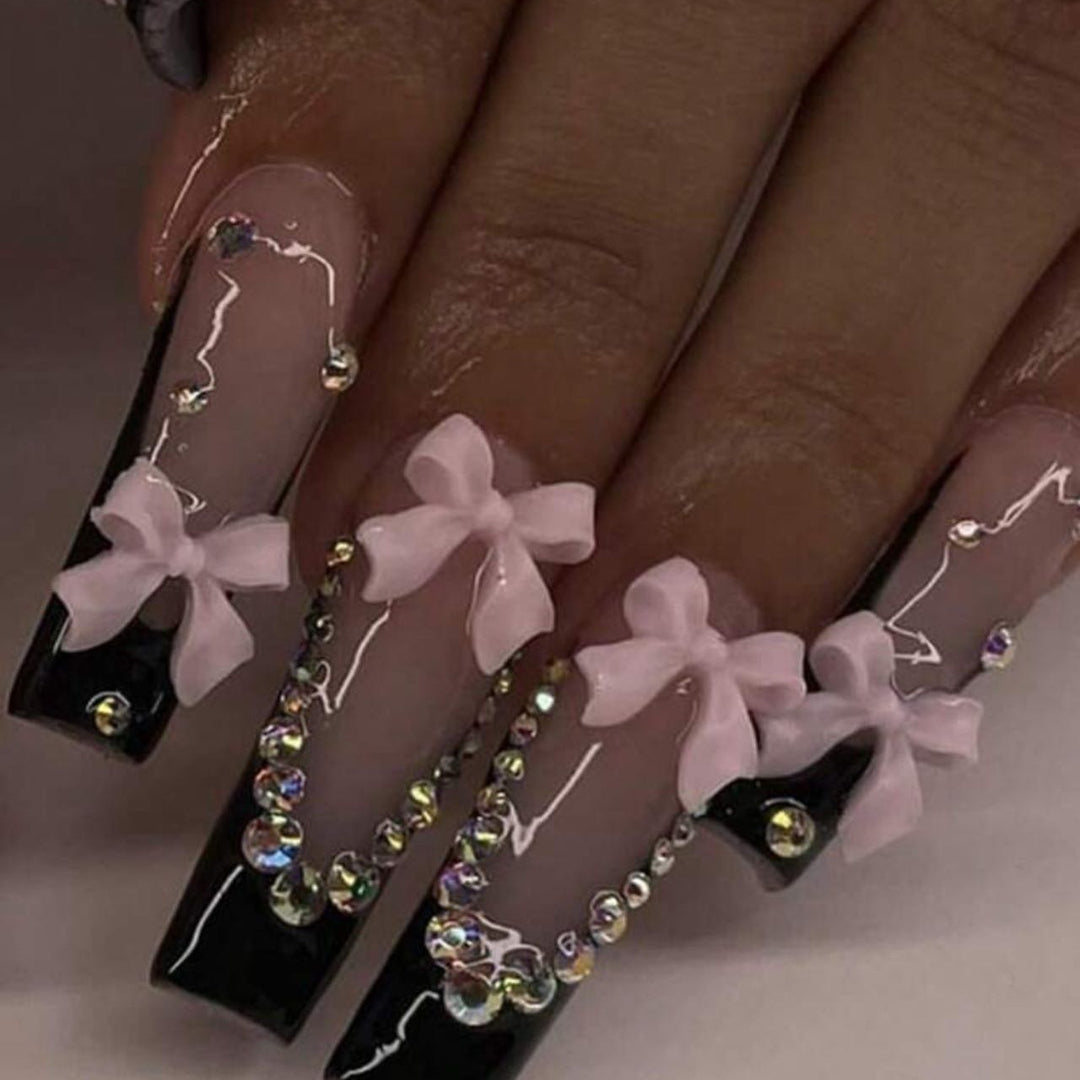 Artificial nails with elegant bows and rhinestone embellishments Kalsten