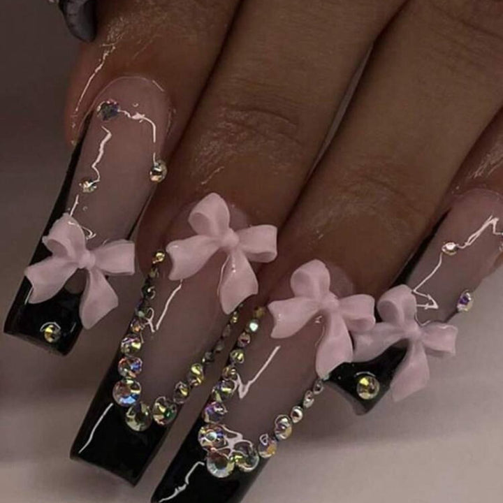 Artificial nails with elegant bows and rhinestone embellishments Kalsten