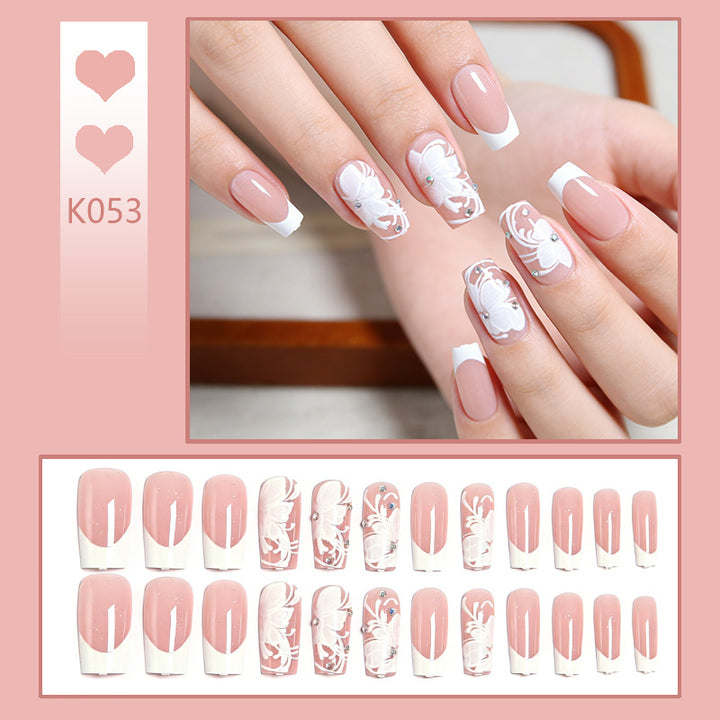 Artificial nails with floral embellishments and glitter details Kalsten