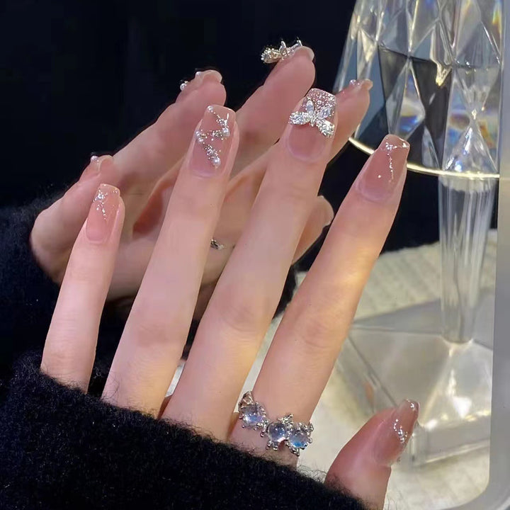 Artificial nails with heart design and glitter accents Kalsten