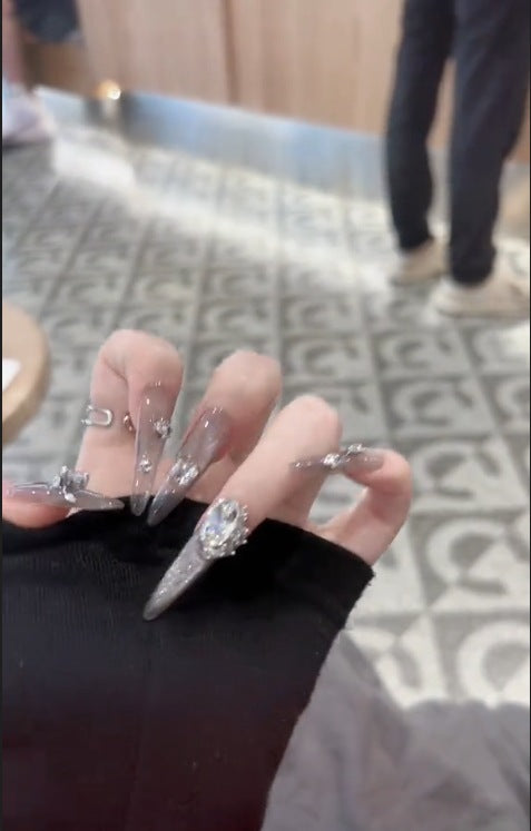 Glamorous artificial nails with rhinestone accents Kalsten