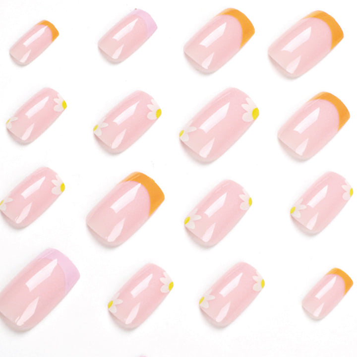 Artistic acrylic nails with floral design and creative color accents Kalsten