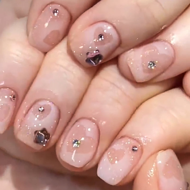 Artistic Nail Art with Glitter and Heart Designs Kalsten