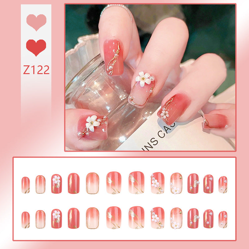 Acrylic nail set with elegant floral decorations and glamorous pearl accents Kalsten