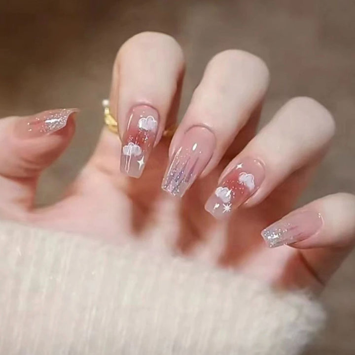 Artistic Nail Art with Glitter and Flower Applications Kalsten