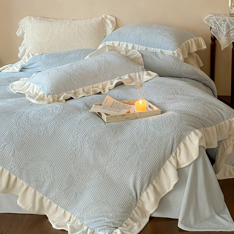 Ruffled quilted bedding set with jacquard medallion and ruffle