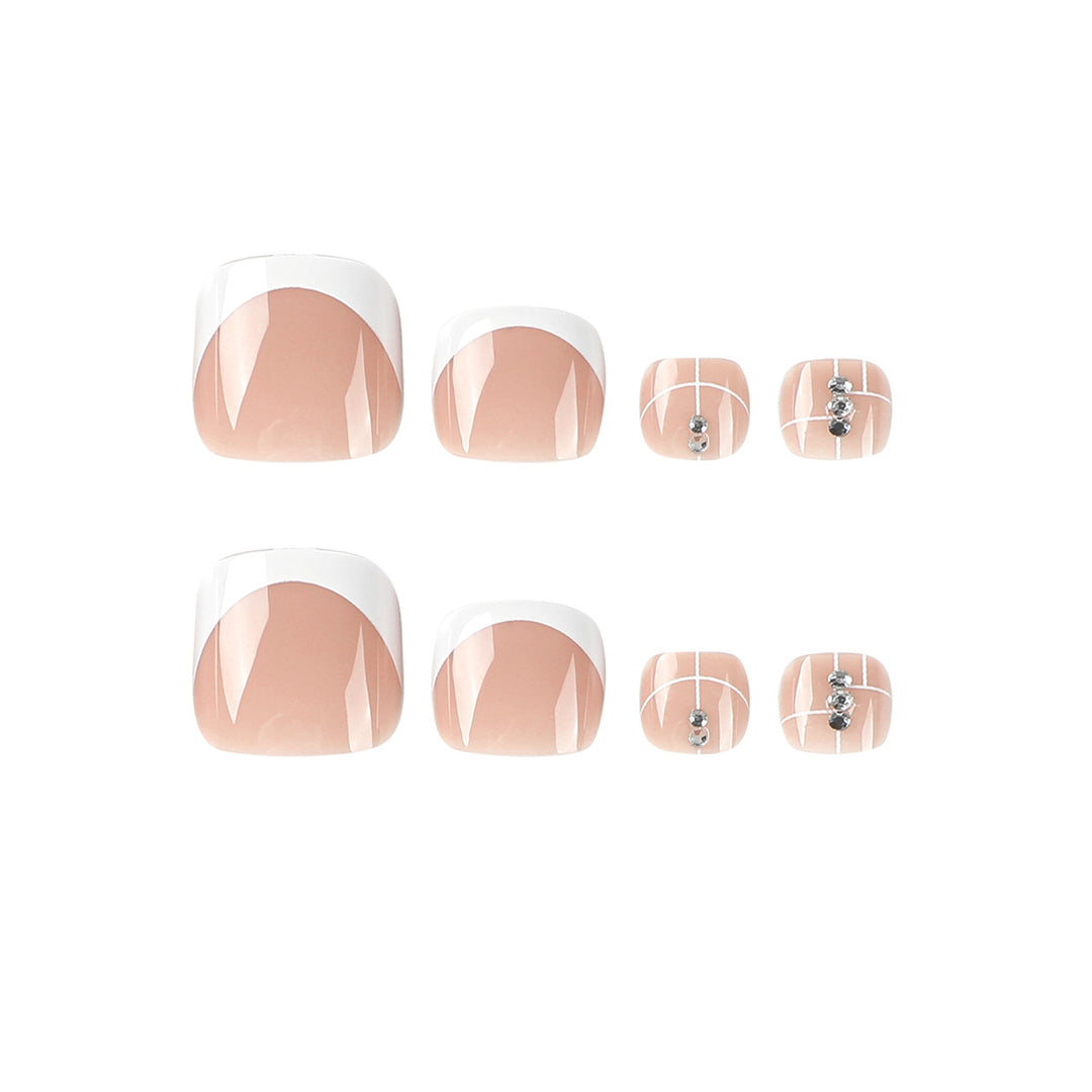 Artful toenail design with elegant style and rhinestone embellishments Kalsten