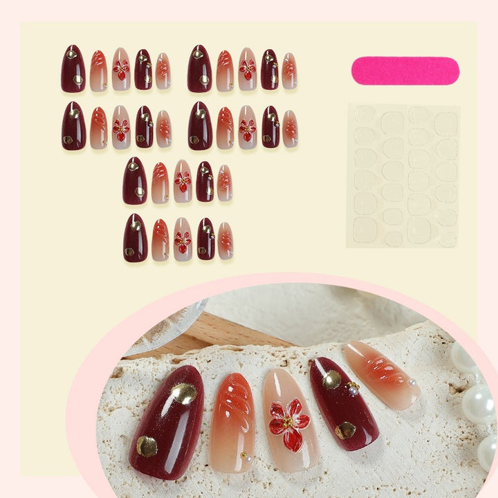 Acrylic nail set with elegant floral accents and glitter details Kalsten