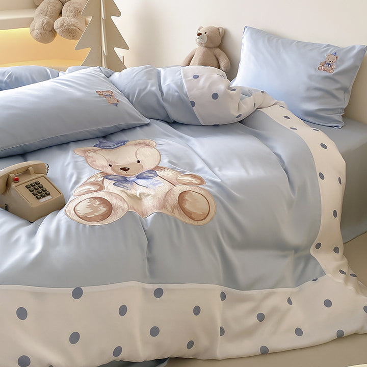 Reversible satin bedding set for children with a large watercolor teddy, polka dot border, and silky-matte finish