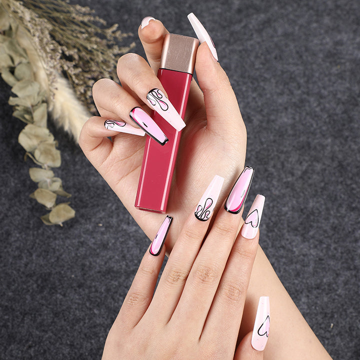 Eye-catching artificial nails with soulful heart design and glamorous accents Kalsten