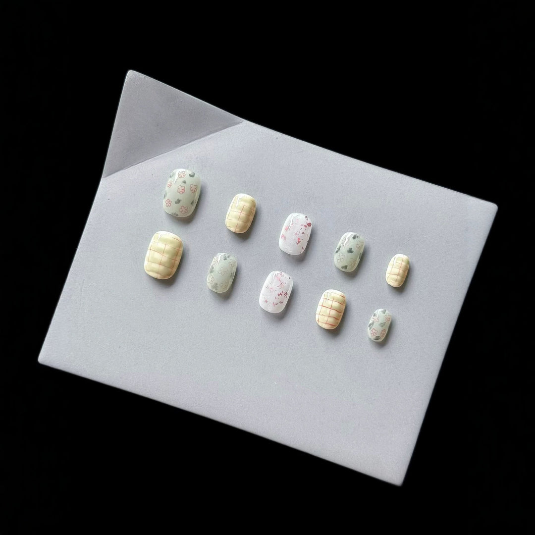 Artistic Press-On Nail Art Set with Floral and Abstract Patterns