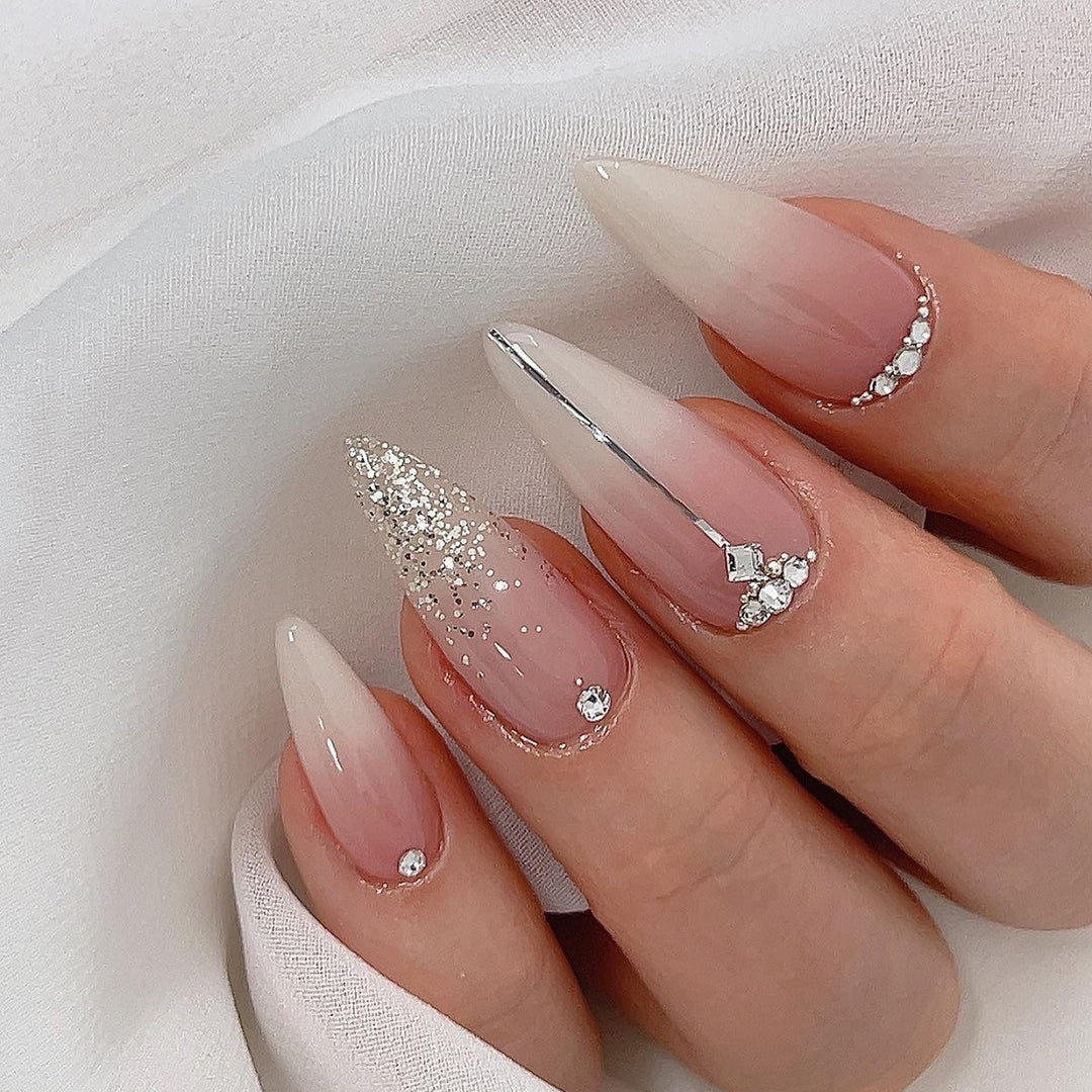 Glamorous stiletto nails with glitter and rhinestone accents Kalsten