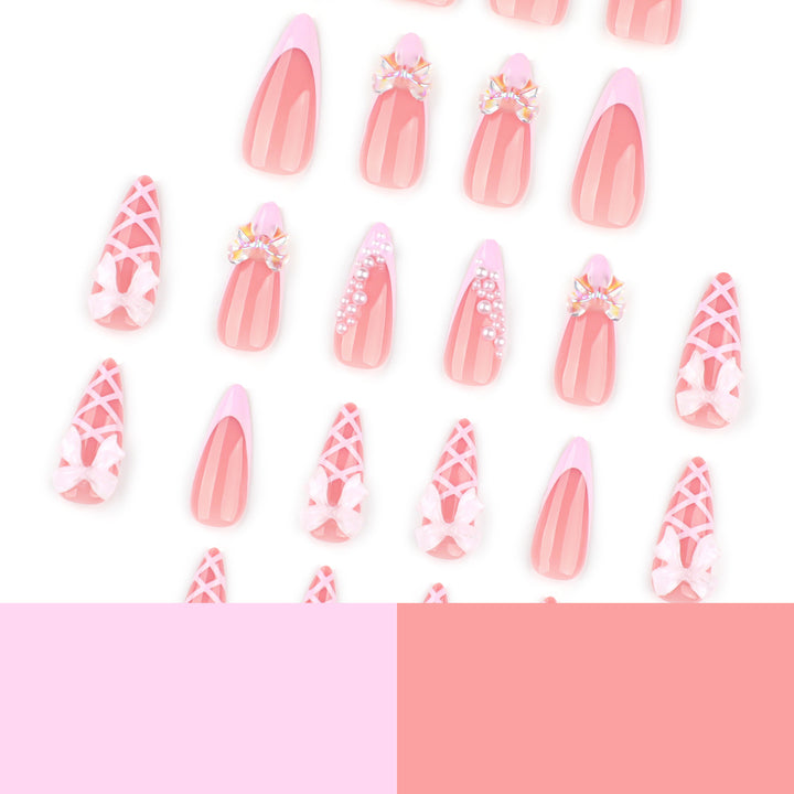 Artful stiletto nails with glitter and bow decoration Kalsten