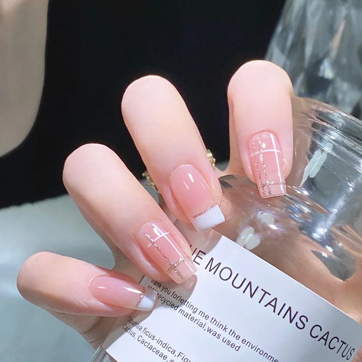 Nail set with elegant French tip and fashionable embellishments Kalsten