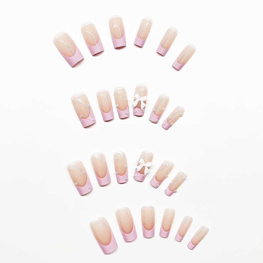 Artificial nail set with romantic bow and pearl embellishments Kalsten