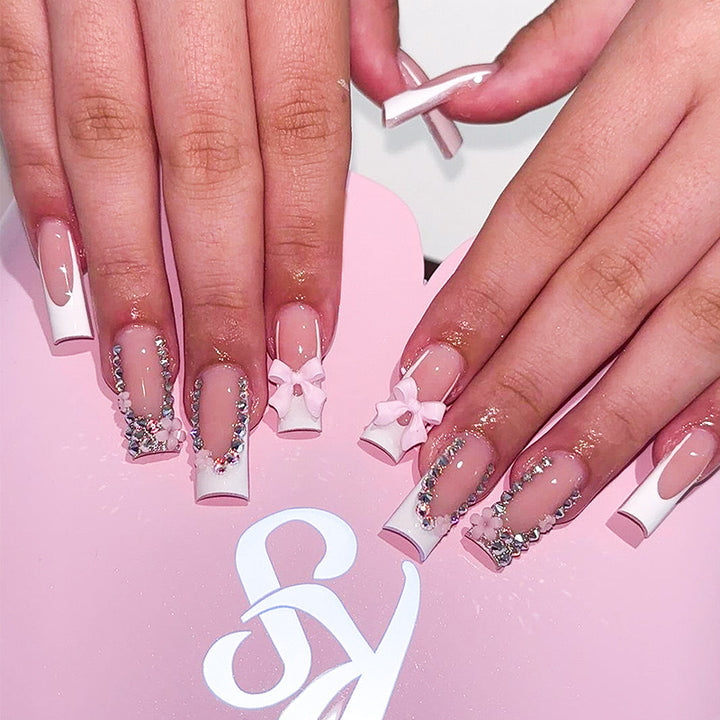 Artificial nail set with careful ribbon and glitter decorations Kalsten