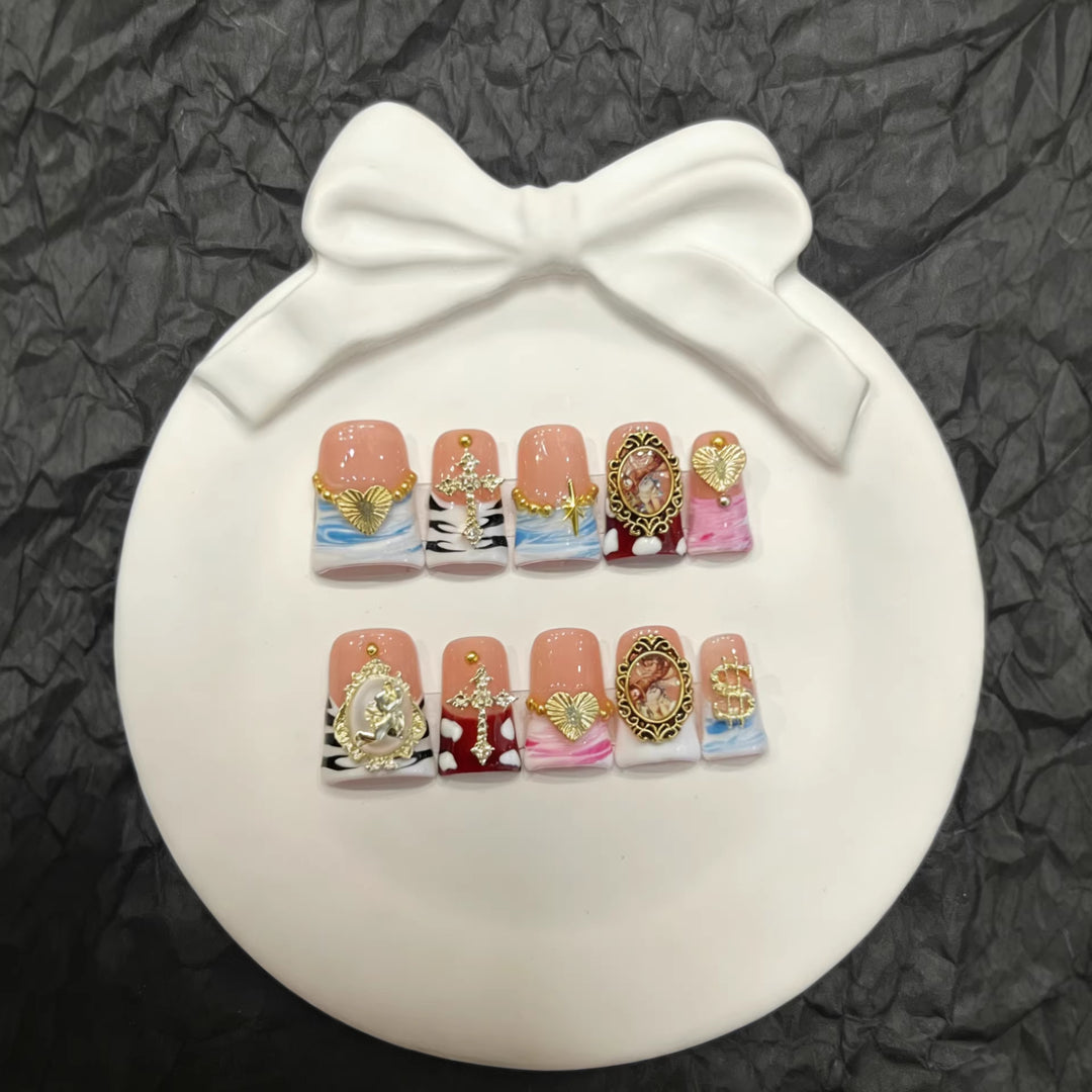 Artistic Press-On Nail Set with Gold Accents and Unique Designs
