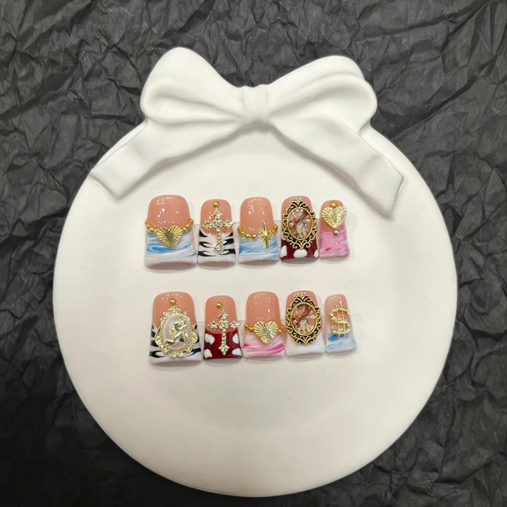 Artistic Press-On Nail Set with Gold Accents and Unique Designs
