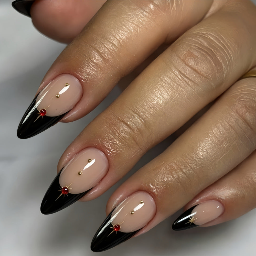 Glamorous artificial nails in stylish stiletto design with golden accents Kalsten