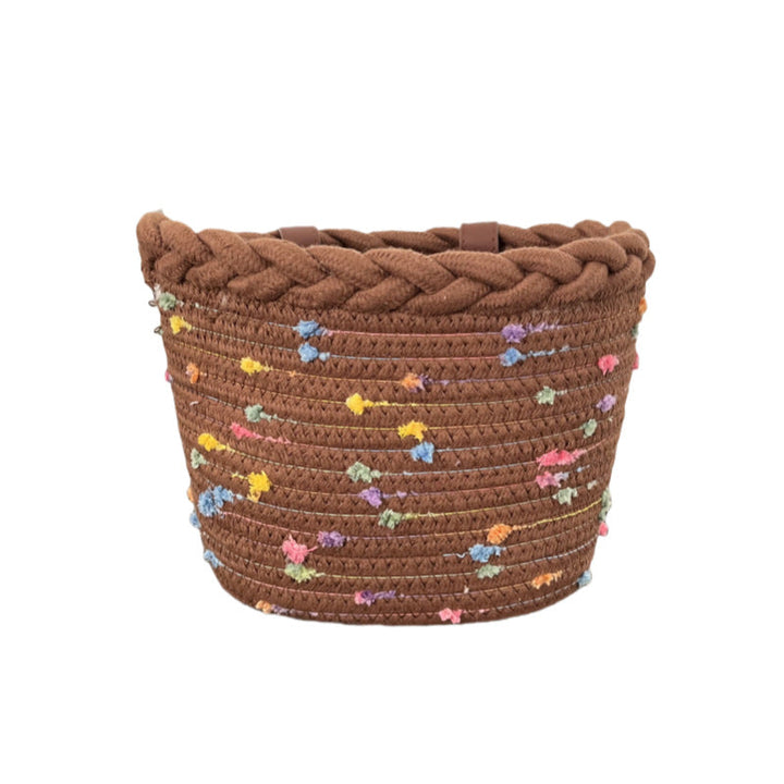 braided rope bike basket with pom pom embellishments and leather handlebar straps Kalsten