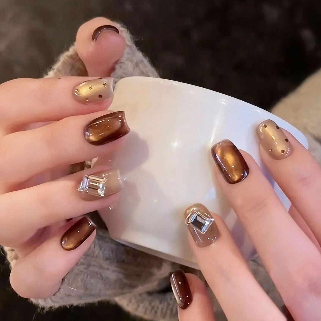 Acrylic nail set with elegant ombre designs and sparkling accents Kalsten