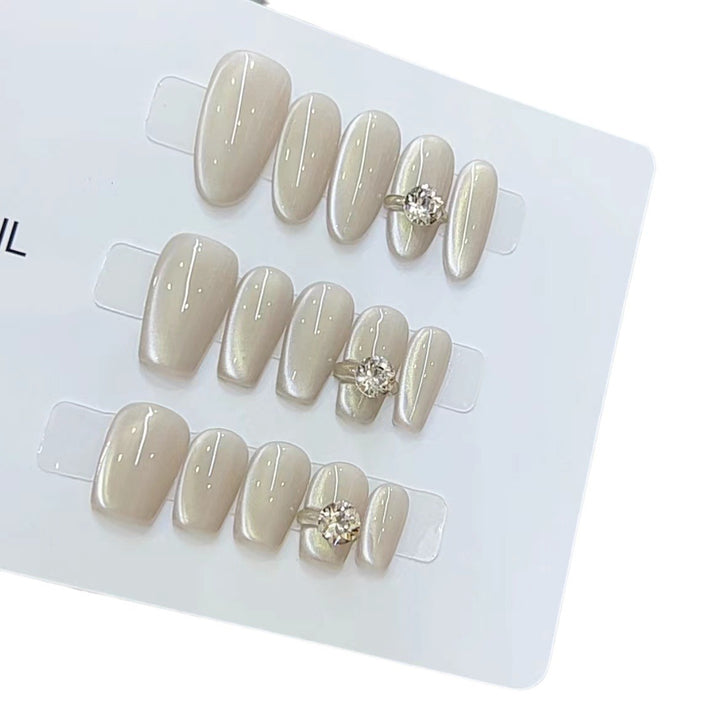 Elegant Press-On Nail Art with Jewel Accents Kalsten