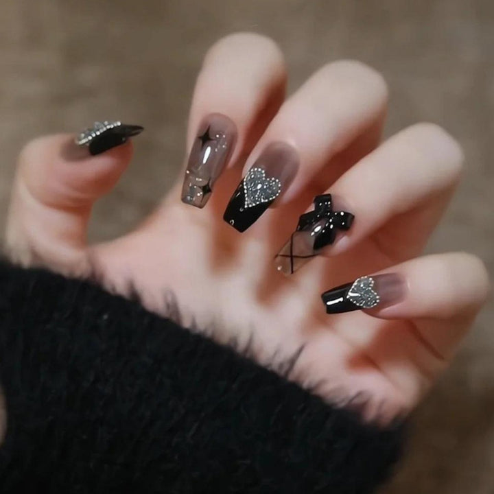 Glamorous artificial nails with heart and glitter details Kalsten