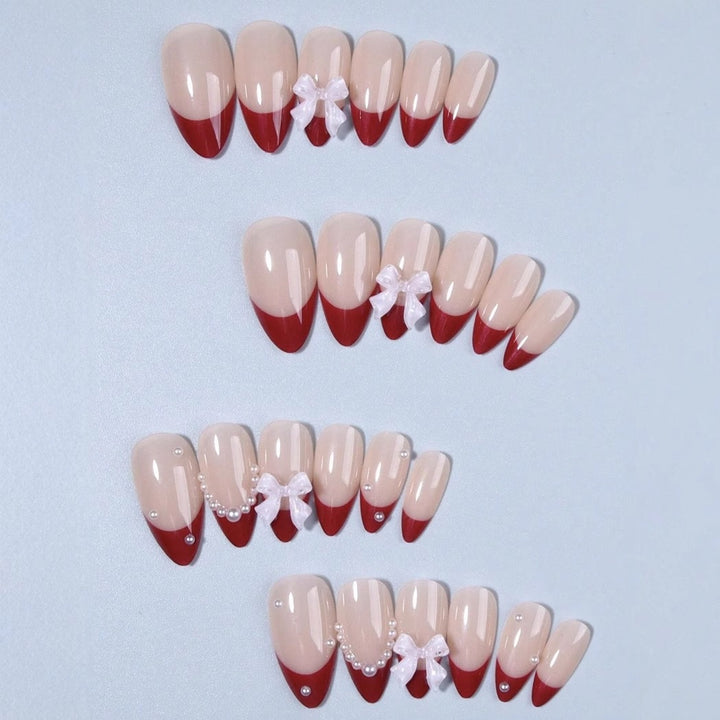 Artificial nail set with glamorous rhinestone and bow decorations Kalsten