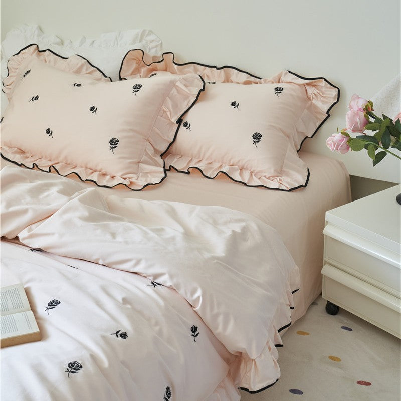 Bedding set with embroidered roses, ruffle details and extra soft cotton satin