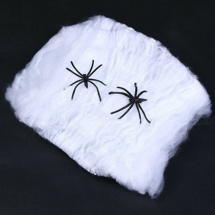 Decorative Halloween spider web with artificial spiders
