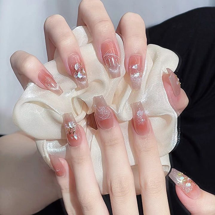 Nail art set with elegant wave patterns and delicate pearl accents Kalsten