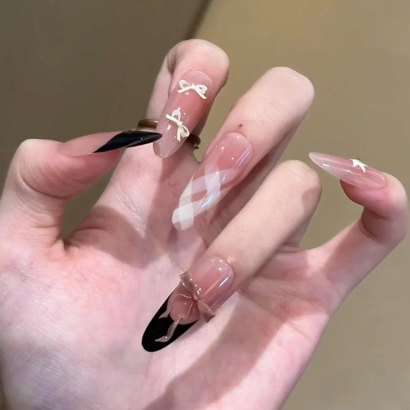 Glamorous artificial nails with creative embellishments Kalsten