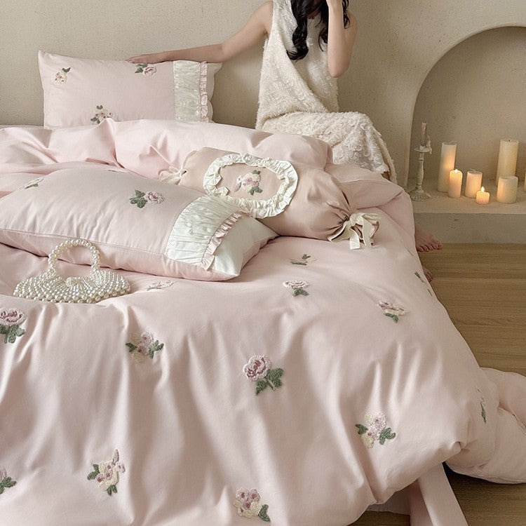 Luxurious cotton bedding set with delicate rose embroidery and ruffles