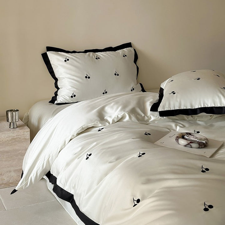 Luxurious satin bedding set with cherry embroidery and contrasting trim