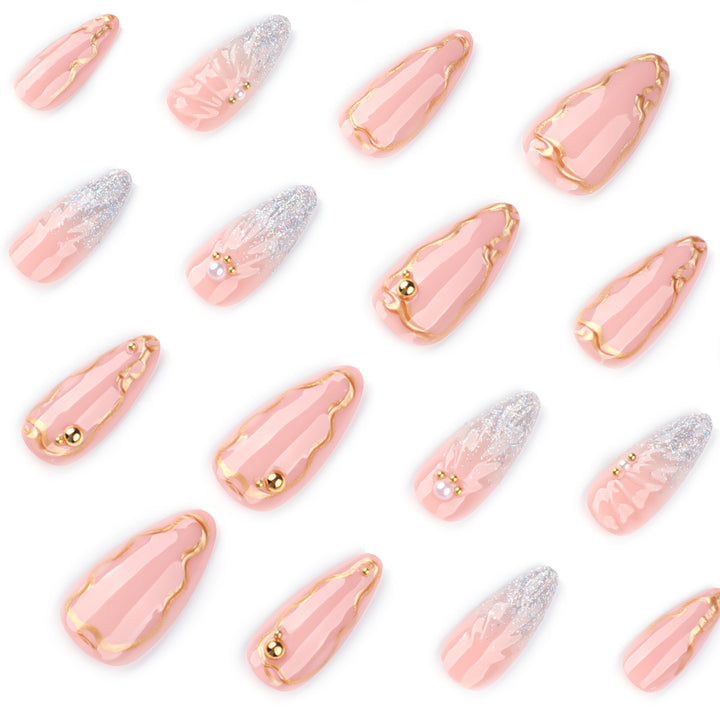 Artful stiletto nails with elegant gold embellishment design Kalsten