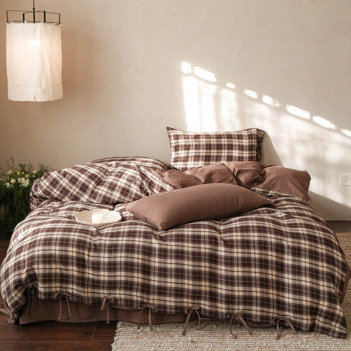 Checked cotton bedding set with decorative ribbons, ruffles, and subtly embroidered detail
