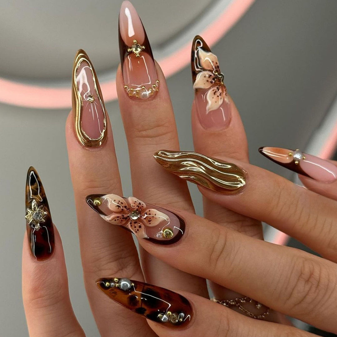 Artistic Stiletto Press-On Nail Art with Floral and Gemstone Accents Kalsten