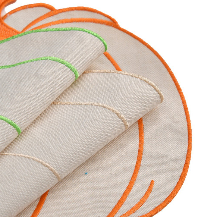 Seasonal table mat placemat made of linen in pumpkin silhouette with colorful embroidered border