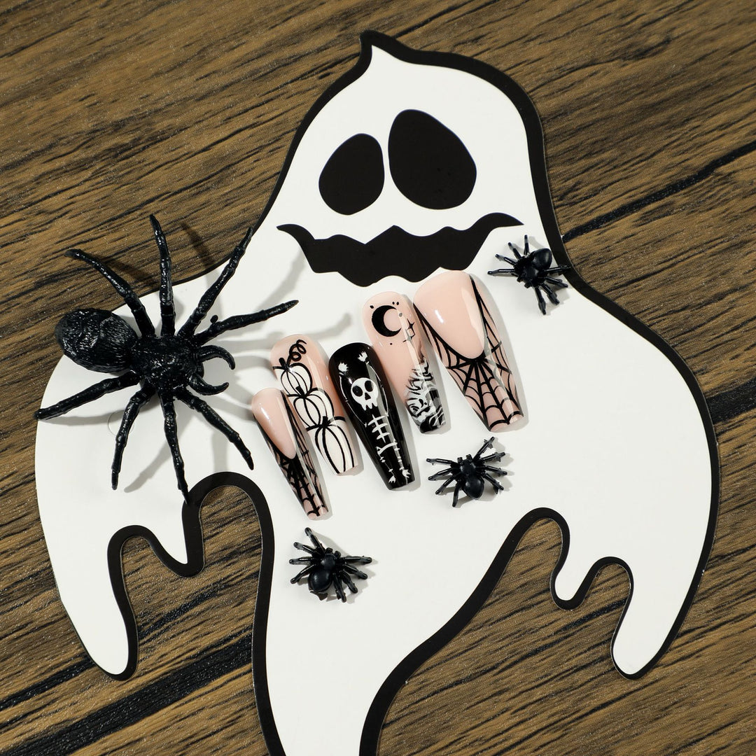 Artificial nail art in Halloween style with graffiti designs Kalsten