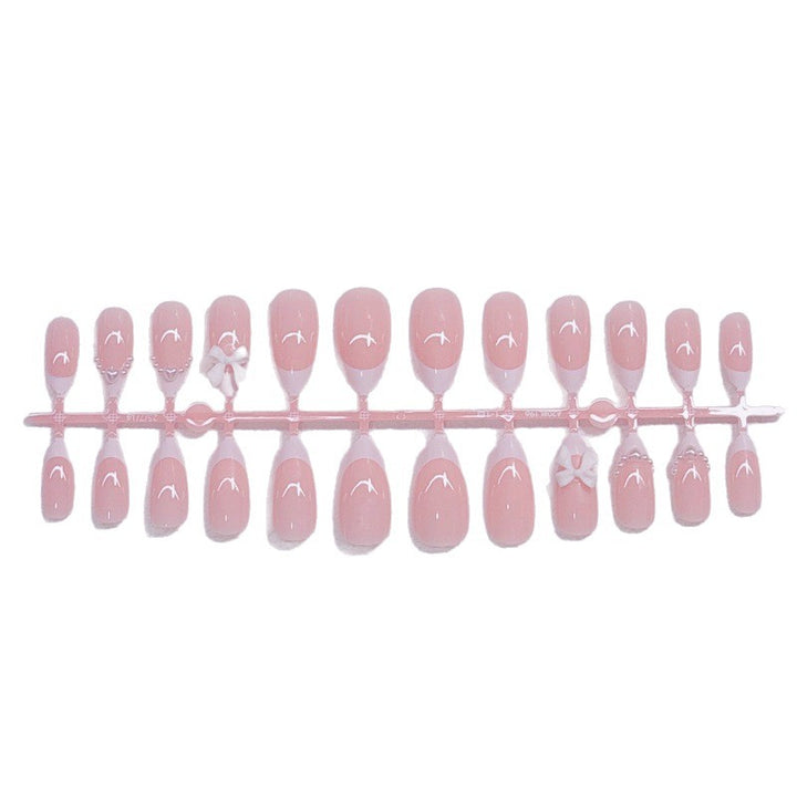 Elegant artificial nails with curved tips and decorative bows Kalsten