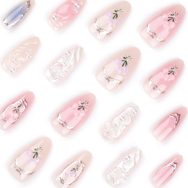 Artful nail extensions with elegant flower decoration Kalsten