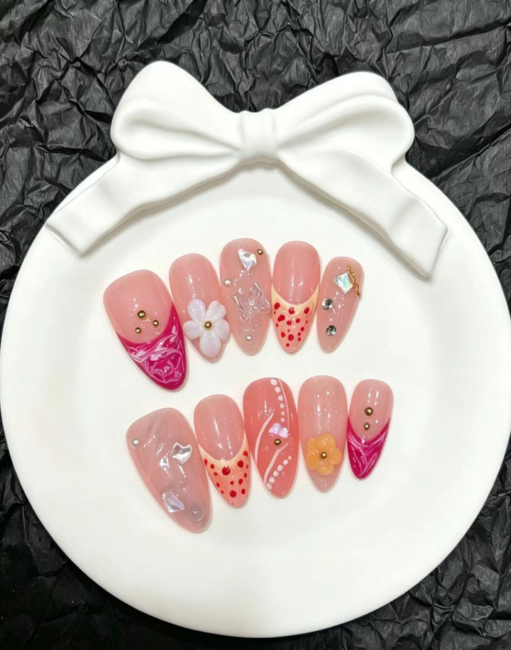 Artistic Press-On Nail Set with Floral and Decorative Elements