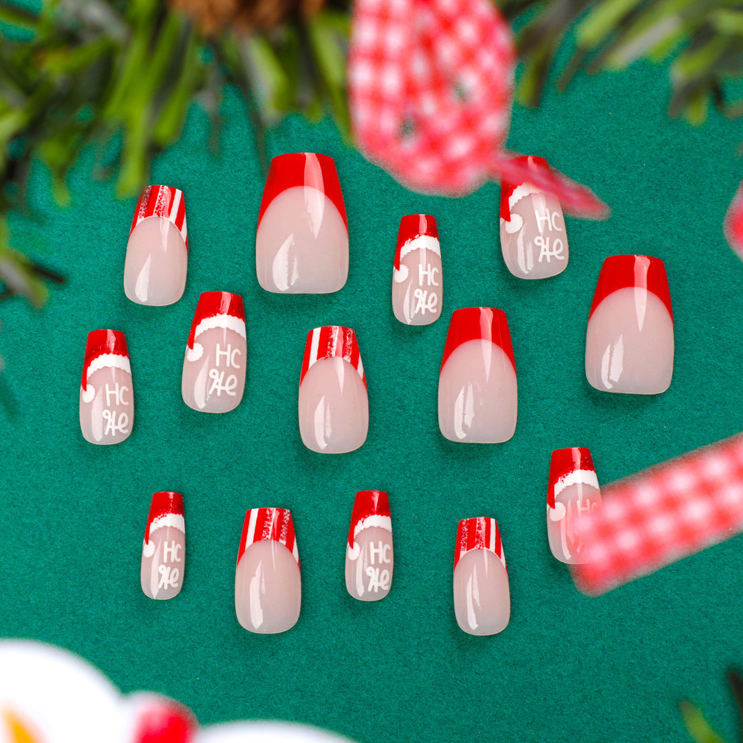 Artificial nail extensions in festive Christmas design Kalsten