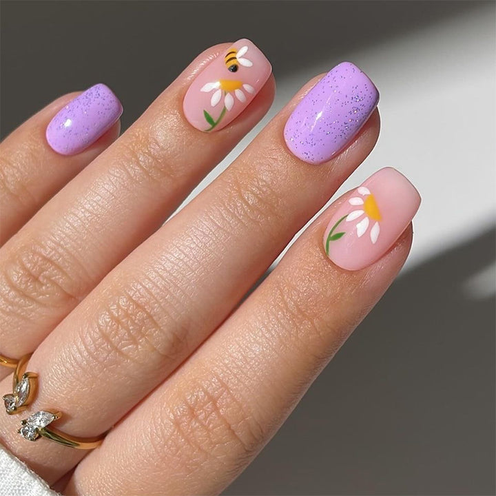 Artfully designed nail extensions with flower design Kalsten