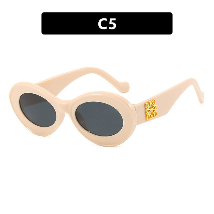 Women's fashionable sunglasses with oval frame and golden accents Kalsten