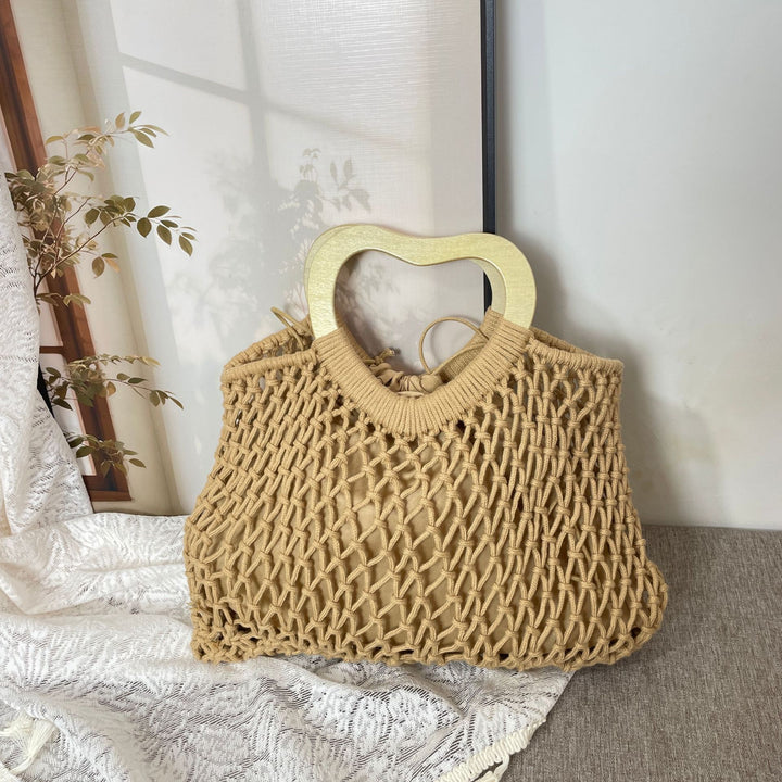 Stylish handbag with heart-shaped handle Kalsten
