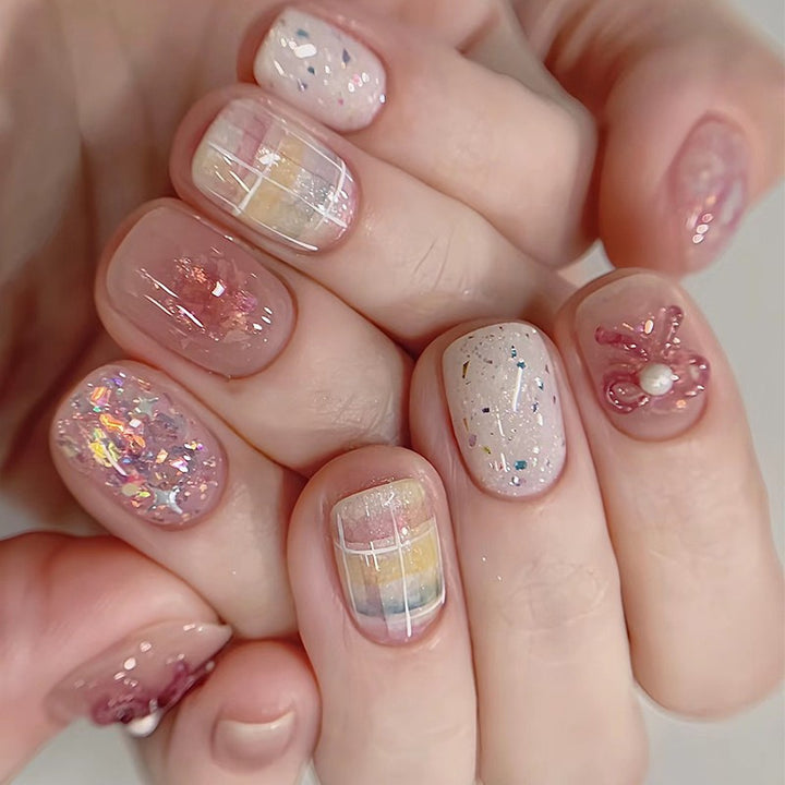 Creative nail art set with glitter and floral applications Kalsten