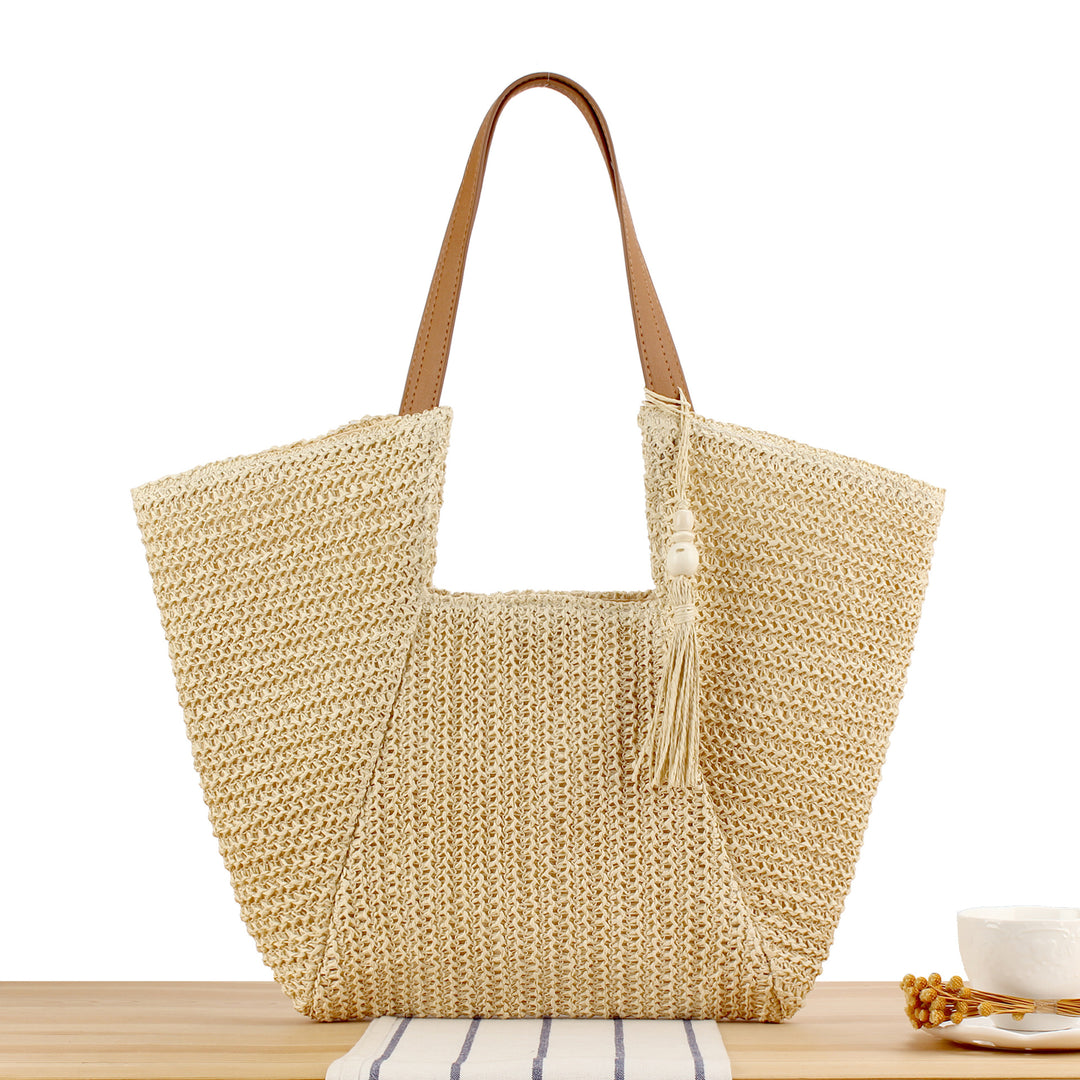 Beach bag made of natural weave with elegant leather accents Kalsten