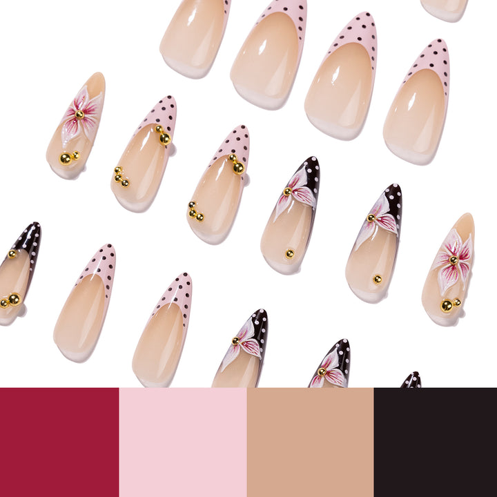 Artful stiletto nails with floral accents and glitter Kalsten